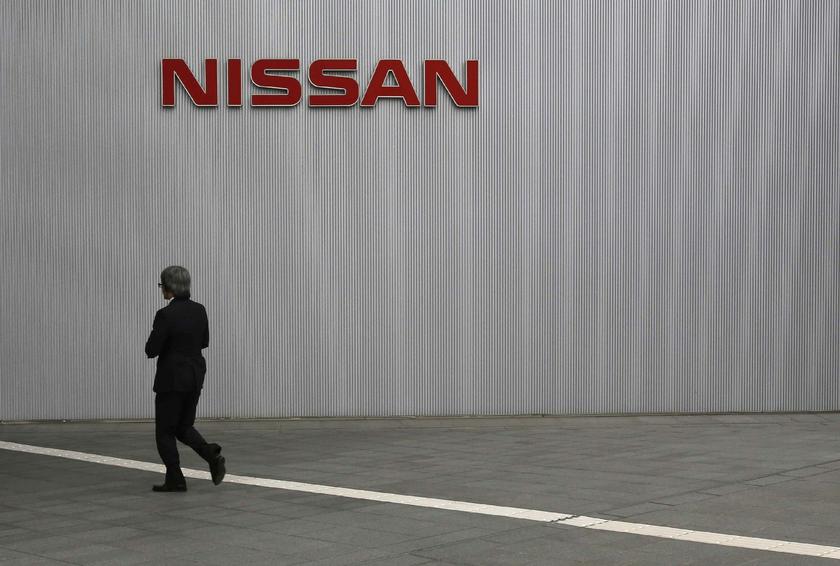 A visitor walks toward to the entrance of Nissan Motor Cou00e2u20acu2122s global headquarters in Yokohama, south of Tokyo May 10, 2013. u00e2u20acu201d Reuters pic
