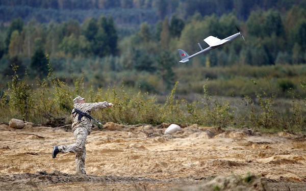 A soldier sets off a drone at a military ground near the town of Osipovichi, some 100km southeast of Minsk, September 25, 2013. Military groups from Armenia, Belarus, Kazakhstan, Kyrgyzstan, Russia and Tajikistan took part in joint military exercises yest
