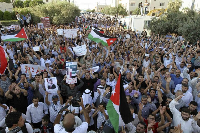 Demonstrators from the Islamic Action Front take part in a rally near the Egyptian embassy in Amman August 14, 2013, in support of deposed Egyptian president Mohamed Mursi