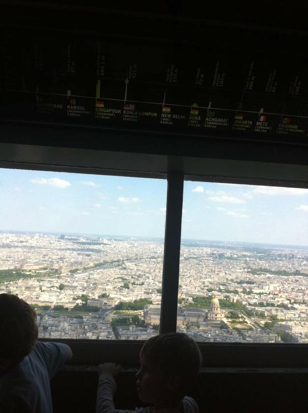 At the Eiffel Tower’s summit: the wall installation above the Parisian vistas lists Kuala Lumpur as being 10,433km away (not that far...) and notes its highest building the Menara KL Tower at 421metres. A piece of Malaysia in Paris.