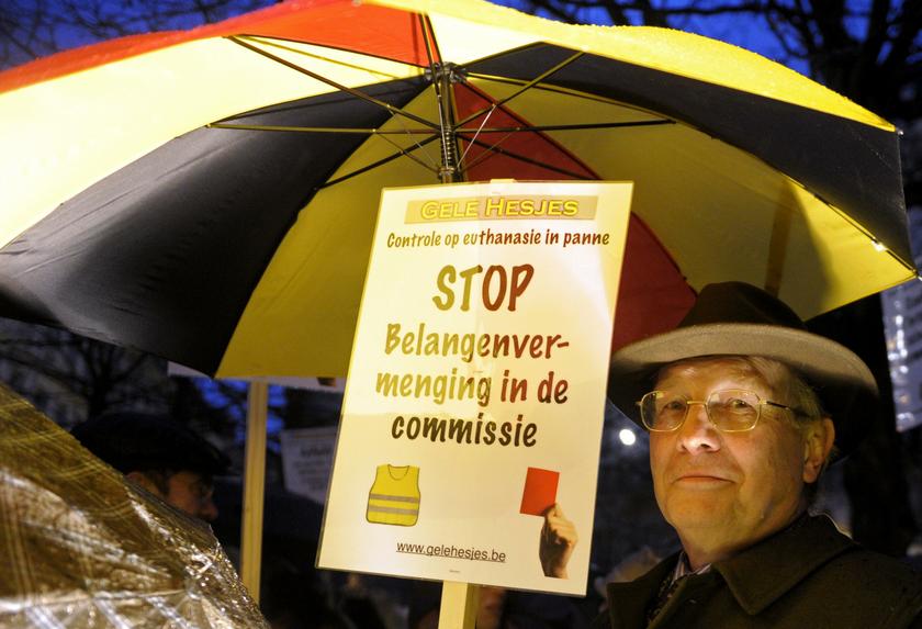 A protester holds up a sign during a demonstration against a new law authorizing euthanasia for children, in Brussels February 11, 2014. u00e2u20acu201d Reuters pic