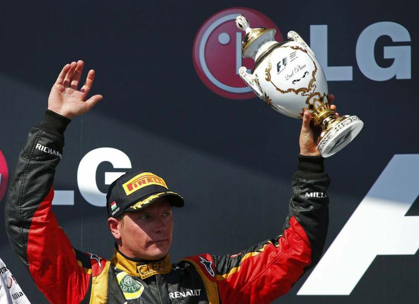 Lotus F1 Formula One driver Kimi Raikkonen of Finland holds up his trophy on the podium after placing second in the Hungarian F1 Grand Prix at the Hungaroring circuit in Mogyorod, near Budapest, on July 28, 2013. u00e2u20acu201d Reuters pic