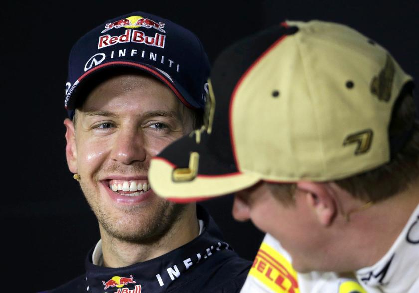 Red Bull Formula One driver Sebastian Vettel (L) with Lotus driver Kimi Raikkonen of Finland post-race news conference Singapore F1 Grand Prix Marina Bay street circuit Singapore September 22, 2013 Reuters pic