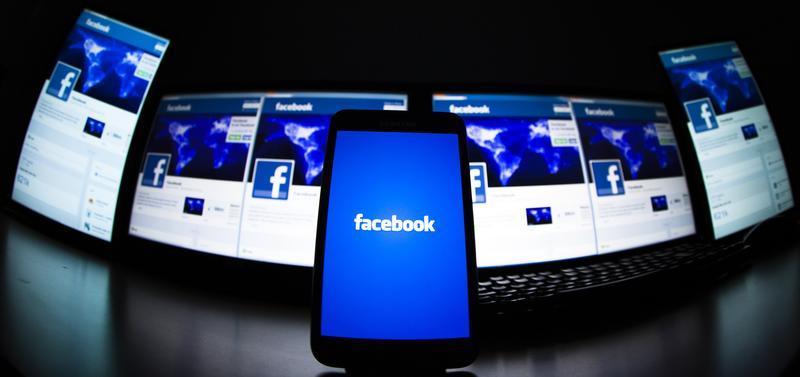 The loading screen of the Facebook application on a mobile phone is seen in this photo illustration taken in Lavigny May 16, 2012. u00e2u20acu201d Reuters pic