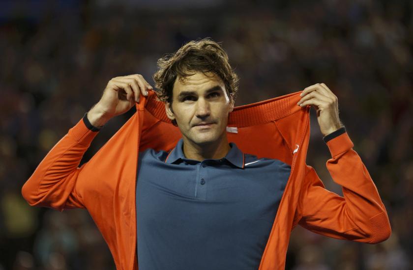Roger Federer of Switzerland puts on a jacket after his men's singles match against Jo-Wilfried Tsonga of France at the Australian Open 2014 tennis tournament in Melbourne January 20, 2014. u00e2u20acu201du00c2u00a0Reuters pic