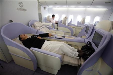 A woman checks out a first-class seat of the Airbus A380 superjumbo during a media tour in Shanghai in this October 25, 2007 file photo. u00e2u20acu201d Reuters pic