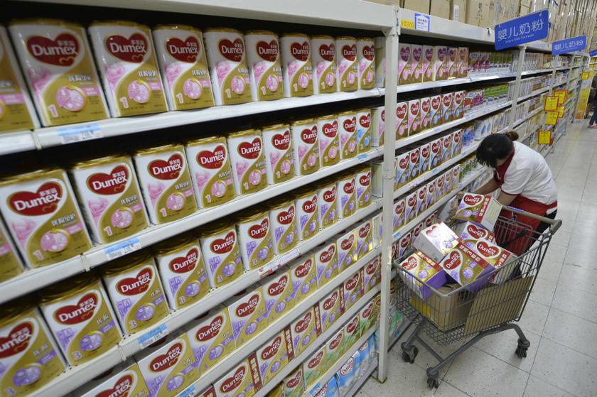 A sales assistant takes down Dumex milk powder products from shelves, which were included in a recall programme by Fonterra, at a supermarket in Taiyuan, Shanxi province August 5, 2013. u00e2u20acu201c Reuters pic