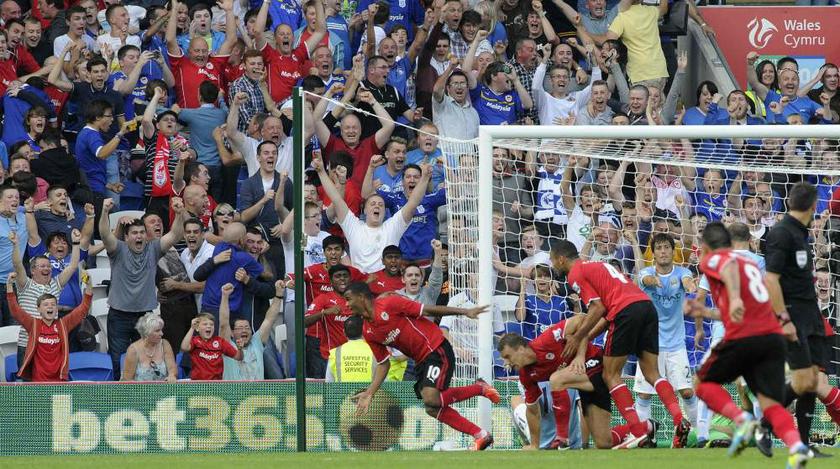 Cardiff Cityu00e2u20acu2122s Fraizer Campbell (left) celebrates after scoring a goal against Manchester City during their English Premier League match at Cardiff City Stadium, Cardiff, on August 25, 2013. u00e2u20acu201d Reuters pic