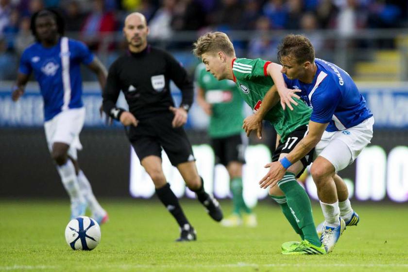 Legia Warsawu00e2u20acu2122s Dominik Furman (left) is challenged by Fredrik Gulbrandsen of Molde during their Champions League third-round qualifying match in Molde, Norway on July 31, 2013. u00e2u20acu201d Reuters pic