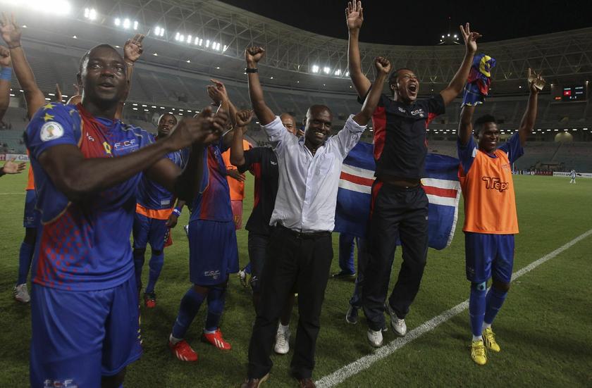 Cape Verde players celebrate with their coach Lucio Antunes (C), after winning their 2014 World Cup qualifying soccer match against Tunisia at the Rades Stadium in Tunis September 7, 2013