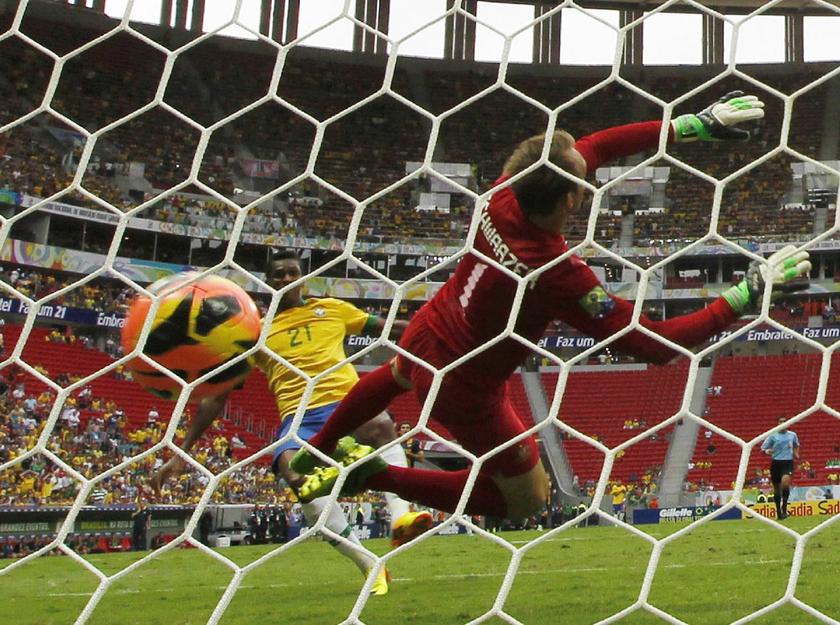 Brazil's Jo (L) scores his second goal past Australia's goalkeeper Mark Schwarzer (R) during their international friendly soccer match in Brasilia September 7, 2013 Reuters pic