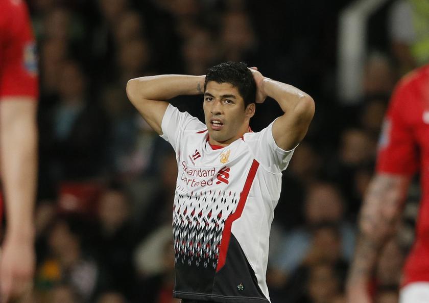 Liverpool's Luis Suarez reacts during their English League cup soccer match against Manchester United at Old Trafford in Manchester, northern England September 25, 2013 Reuters pic