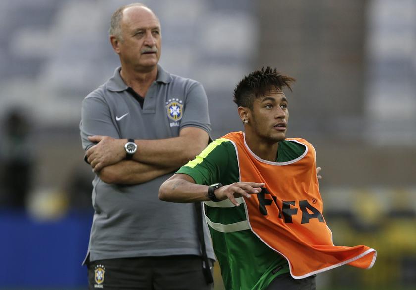 Brazil's national soccer team head coach Luiz Felipe Scolari (L) and player Neymar take part in a training session in Belo Horizonte June 25, 2013. Brazil will play against Uruguay in their Confederations Cup semi-final soccer match on Wednesday. 