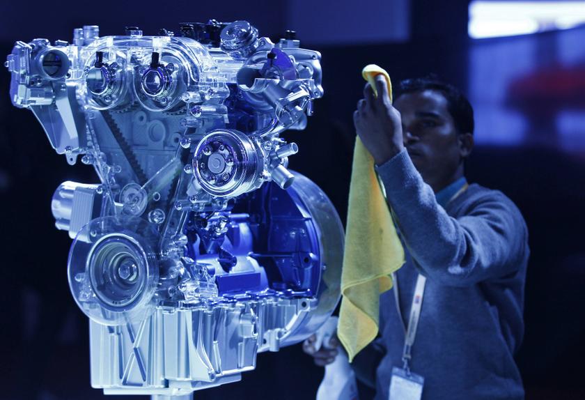 An employee cleans a new generation Ford engine at the Ford pavilion during the Indian Auto Expo in Greater Noida on the outskirts of New Delhi February 5, 2014. u00e2u20acu201d Reuters pic