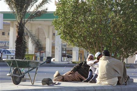 Foreign labourers rest near a construction site in Riyadh, November 23, 2011. u00e2u20acu201d Reuters pic