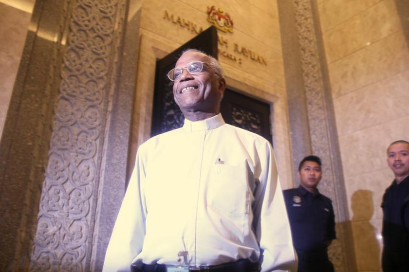 Father Lawrence arrives for a court hearing at the Palace of Justice in Putrajaya, August 22, 2013. — Picture by Choo Choy May