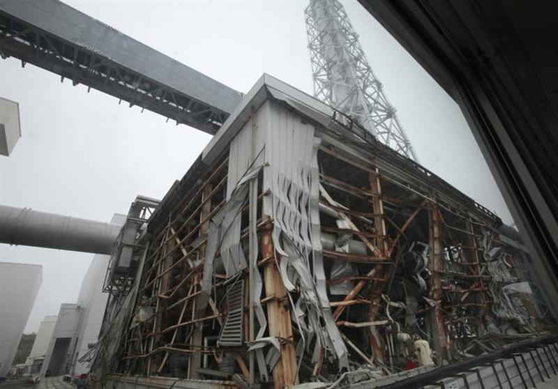 A general view of a building of Tokyo Electric Power Company's (TEPCO) tsunami-crippled Fukushima Daiichi nuclear power plant is seen from a bus during a media tour at the plant in Fukushima prefecture June 12, 2013. u00e2u20acu201c Reuters pic