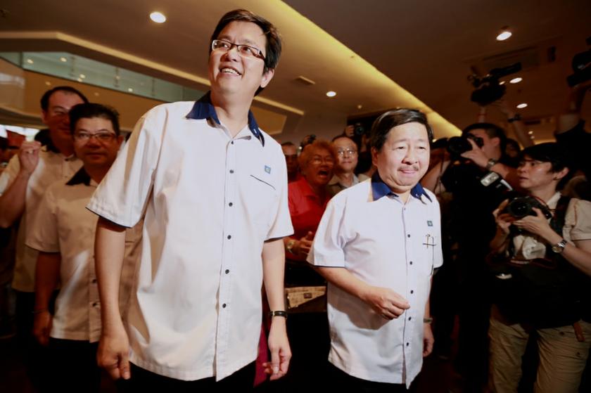 Gan Ping Sieu and Datuk Donald Lim arriving at the MCA building in Kuala Lumpur on December 16, 2013 for the MCA, Youth and Wanita nominations. u00e2u20acu201d Picture by Saw Siow Feng