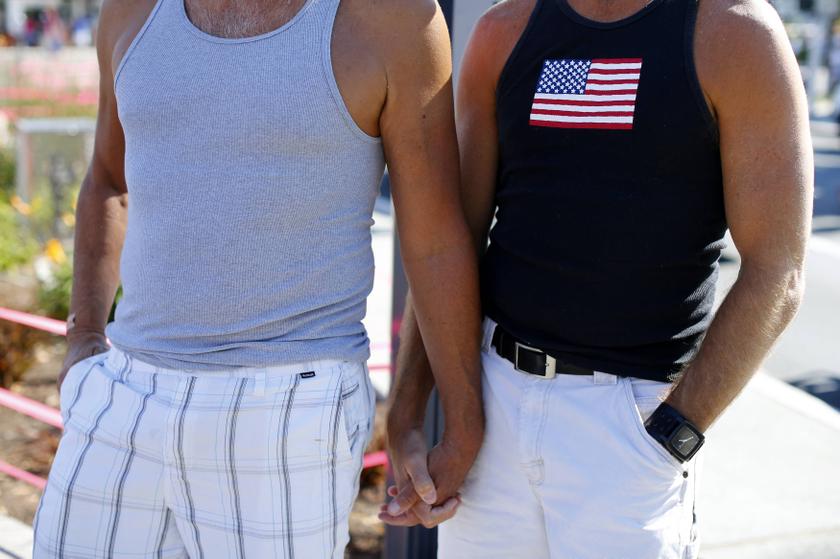 A gay couple holds hands during a rally in support of the United States Supreme Court decision on marriage rights in San Diego, California June 26, 2013. u00e2u20acu201d Reuters pic