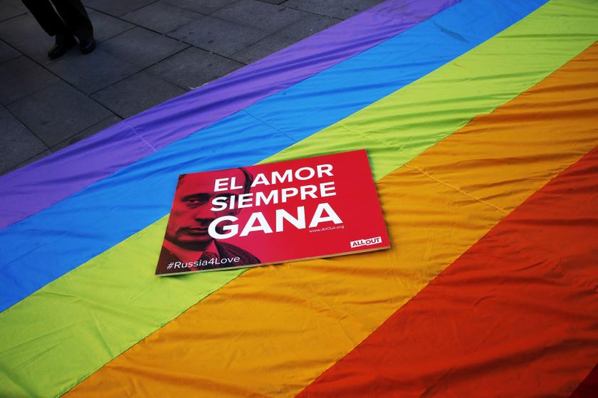 A placard showing Russian President Vladimir Putin next to the words 'Love always wins' is seen on a rainbow flag during a protest in Madrid against Russia's anti-gay laws ahead of the Sochi 2014 Olympic Games February 5, 2014.  u00e2u20acu201d Reuters pic