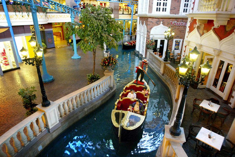 A Venician gondola boat carries visitors in a mini river at the new First World Plaza in Genting Highlands, north of Kuala Lumpur, 27 July 2002. u00e2u20acu201d AFP pic