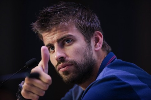 Barcelona player Gerard Pique makes a gesture as he speaks to the media during a press conference in Bangkok on August 5, 2013. u00e2u20acu201d AFP pic