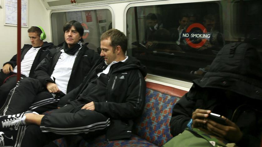 German national football coach Joachim Loew (2nd left) and members of the team, sit in a tube train as they travel on the London underground transport system to Wembley Park station November 18, 2013. u00e2u20acu201d Reuters pic
