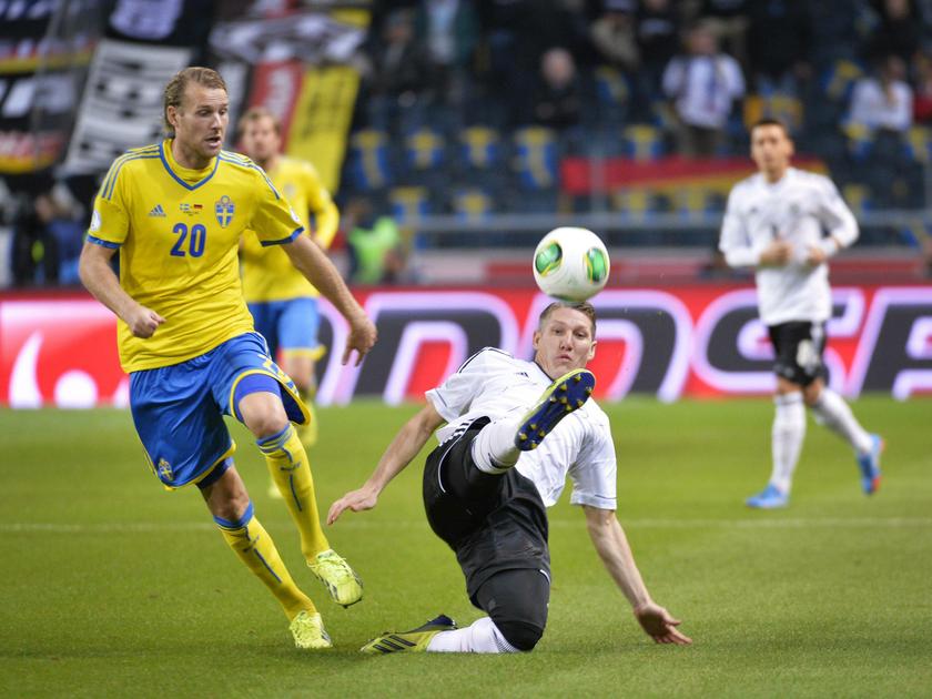 Sweden's Ola Toivonen (left) fights for the ball with Germany's Bastian Schweinsteiger during their 2014 World Cup qualifying match at Friends Arena in Stockholm October 15, 2013. u00e2u20acu201d Reuters pic