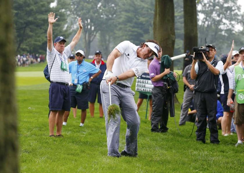 Phil Mickelson hits from the rough on the fourth hole during the second round of the 2013 PGA Championship golf tournament at Oak Hill Country Club in Rochester, New York on August 9, 2013. u00e2u20acu201d Reuters pic