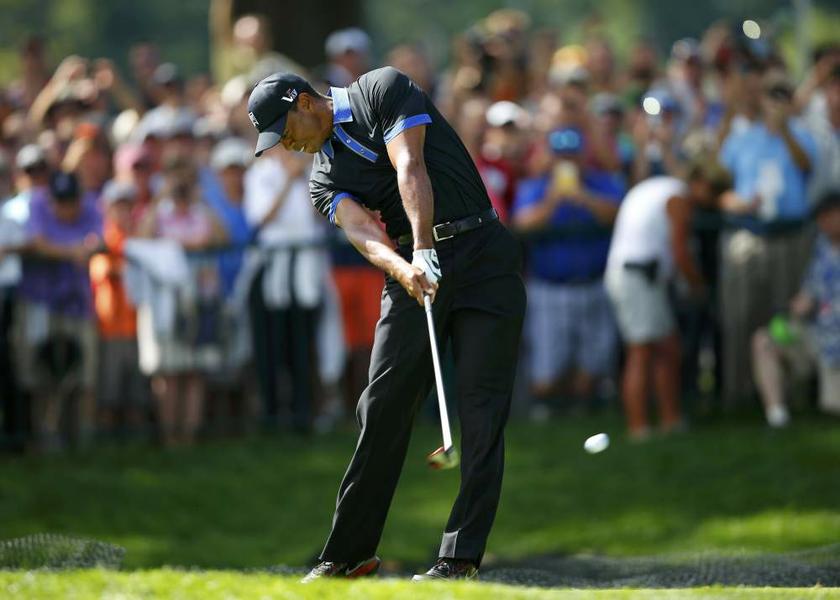 Tiger Woods tees off on the first hole during a practice round for the 2013 PGA Championship golf tournament at Oak Hill Country Club in Rochester, New York, on August 5, 2013. u00e2u20acu201d Reuters pic