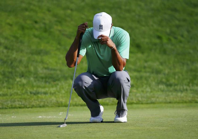 Tiger Woods reacts on the 17th green during the second round of the 2013 PGA Championship golf tournament at Oak Hill Country Club in Rochester, New York on August 9, 2013. u00e2u20acu201d Reuters pic