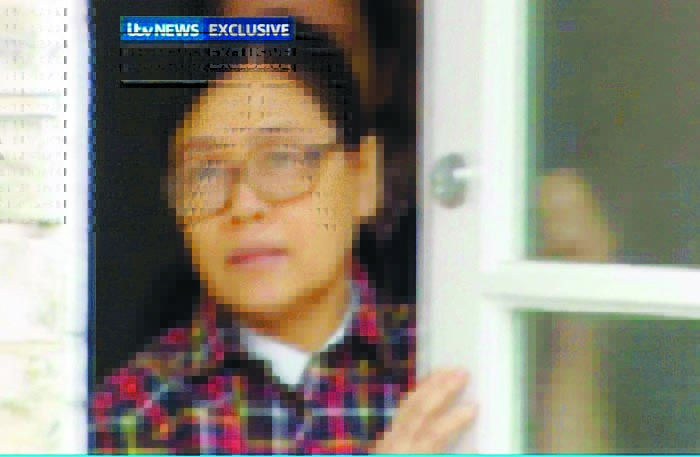  Siti Aishah ignores journalists as she closes the door in ITV News' 1997 news footage. u00e2u20acu201d Picture courtesy of Daily Mail
