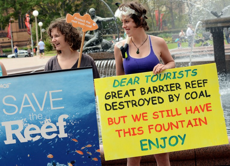 Activists from the 'Protectors of the Reef' collective display placards alongside the Archibald Fountain in central Sydney during a protest in support of Australia's Great Barrier Reef on February 1, 2013. u00e2u20acu201c AFP pic