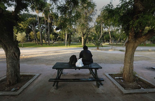 Giorgos, a 58-year-old who became homeless five years ago when he lost his job, sits on a park bench in Athens May 2, 2013. u00e2u20acu201d Reuters pic