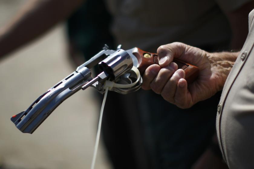 A deputy sheriff looks at a disabled gun to be melted at the Los Angeles County Sheriff's Department's 20th annual Gun Melt at the Gerdau Steel Mill in Rancho Cucamonga, California July 30, 2013. u00e2u20acu201c Reuters pic