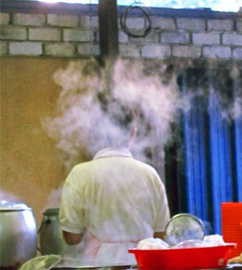 A cook wearing a ghostly halo in Brickfields... a sight seldom seen in top restaurants.