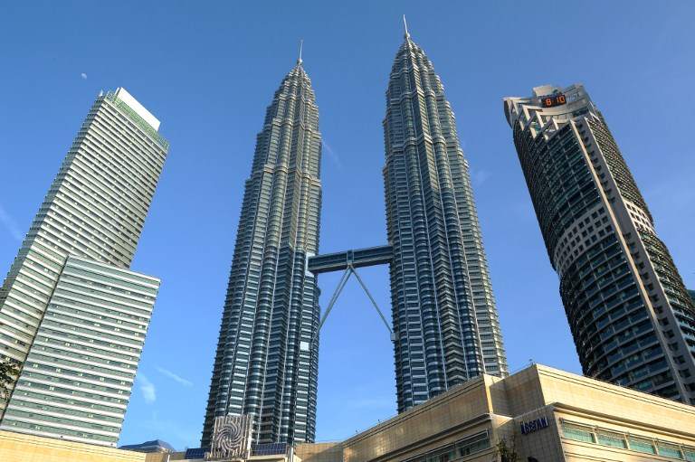A general view shows the landmark Petronas Twin Towers (centre) and commercial buildings as the haze clears in Kuala Lumpur on June 28, 2013. u00e2u20acu201d AFP pic