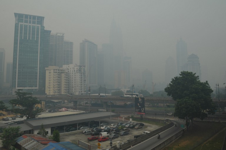 The Kuala Lumpur city skyline is seen shrouded by haze on June 23, 2013. The thick smog brought on by forest fires in Indonesia has choked parts of Malaysia. u00e2u20acu201d AFP pic
