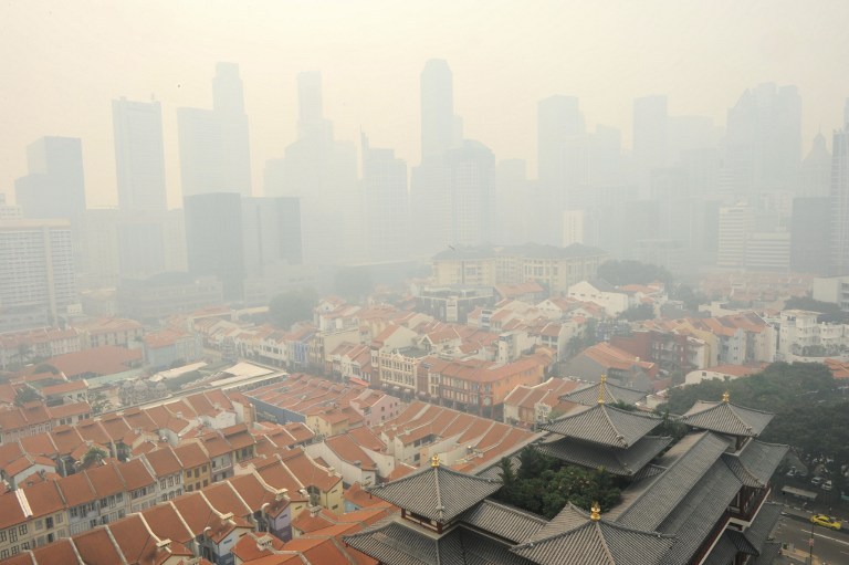 A general view shows part of Singapore shrouded by haze on June 20, 2013. Singapore on June 20 demanded u00e2u20acu02dcdefinitiveu00e2u20acu2122 action by Indonesia on forest fires raging in Sumatra as the two neighbours prepared for emergency talks to ease the severe smog envel