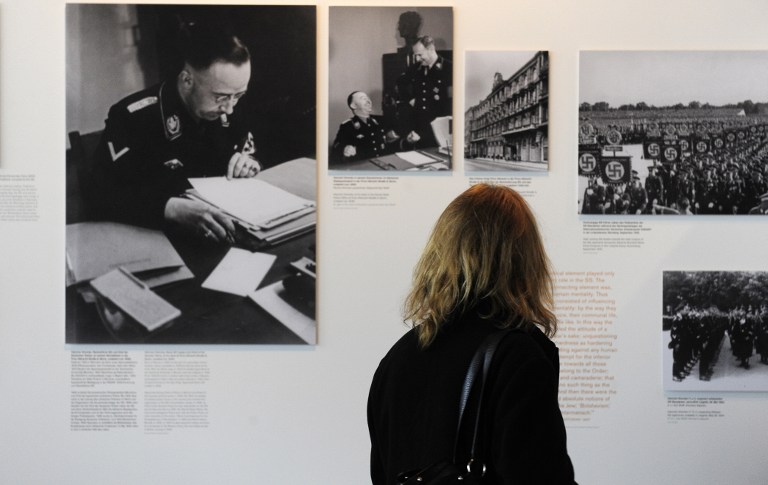 A visitor looks at photographs of SS supremo Heinrich Himmler at the new 'Topographie des Terrors' (Topography of Terror) museum during a press preview in Berlin May 6, 2010. u00e2u20acu201d AFP pic
