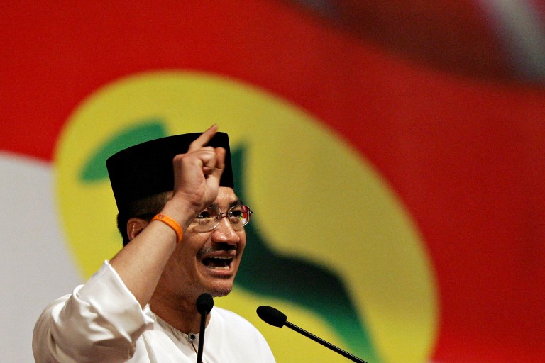 Hishammuddin  gestures as he delivers his speech during the Umno General Assembly in Kuala Lumpur. u00e2u20acu201c AFP pic