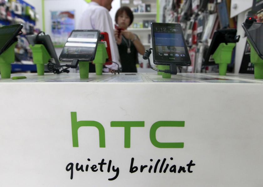 Customers look at HTC smartphones in a mobile phone shop in Taipei July 30, 2013. u00e2u20acu201du00c2u00a0Reuters pic