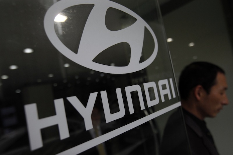 A visitor walks past a Hyundai Motor logo at a Hyundai dealership in Seoul April 25, 2013. u00e2u20acu201d Reuters pic