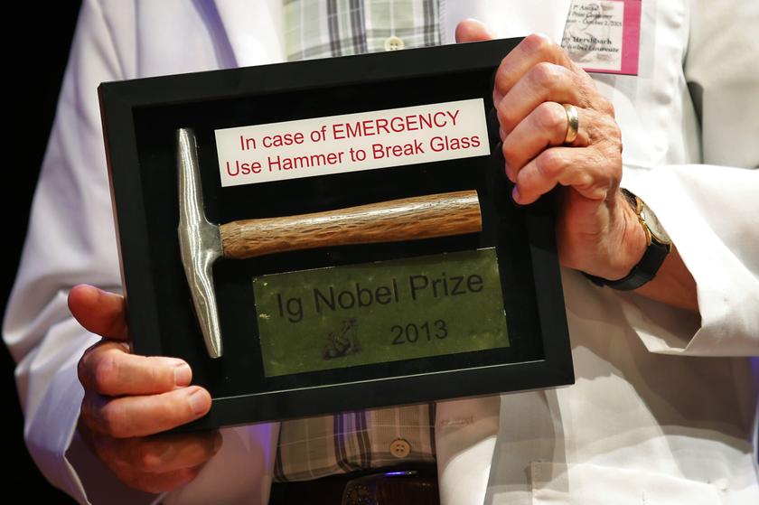 Chemist Dudley Herschbach, winner of the 1986 Nobel Prize for Chemistry, holds an Ig Nobel Prize at Harvard University in Cambridge, Massachusetts Sept 12, 2013. u00e2u20acu201d Reuters pic