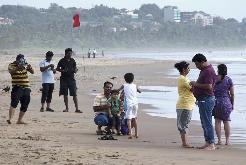 Tourists visit Miramar beach along the Arabian Sea in Goau00e2u20acu2122s capital Panaji on August 29, 2013. u00e2u20acu201d Reuters pic