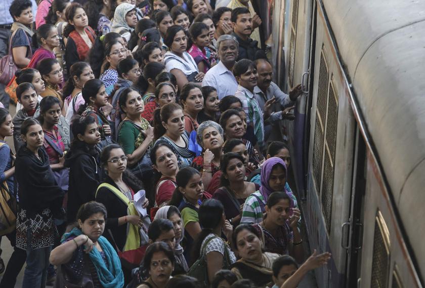 Commuters wait on a crowded railway platform as a train enters a suburban station in Mumbai February 12, 2014. u00e2u20acu201d Reuters pic