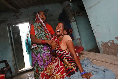 A relative mourns the death of her niece, who died after consuming contaminated meals given to children at a school on Tuesday at Chapra district in the eastern Indian state of Bihar July 18, 2013. u00e2u20acu201d Reuters pic