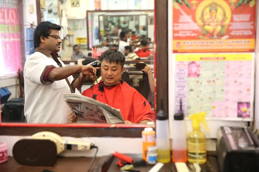 A customer getting a haircut at Stylo.