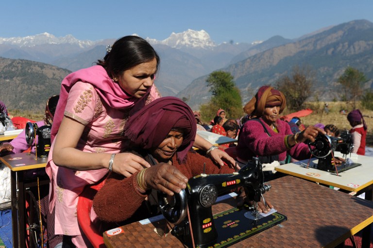 Indian widows, who lost their husbands during the massive floods in the northern Indian states that killed thousands last June, receive vocational training at the Deoli Bhanigram village in northern Uttarakhand state on December 15, 2013. u00e2u20acu201d AFP pic  