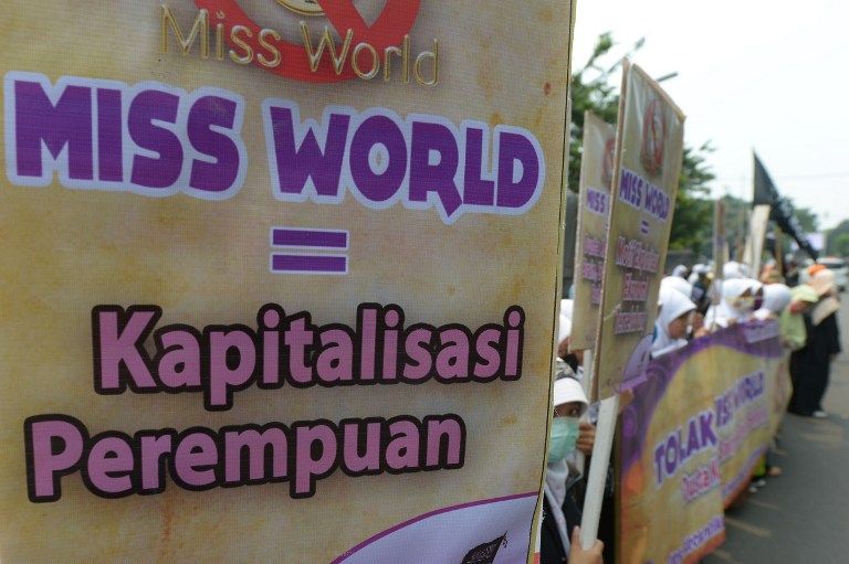Indonesian Muslim women attend a protest against the Miss World beauty pageant contest due to start on September 7 on the Island of Bali, in Jakarta on September 5, 2013